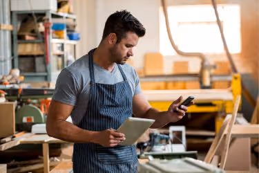 Carpenter checking his social media
