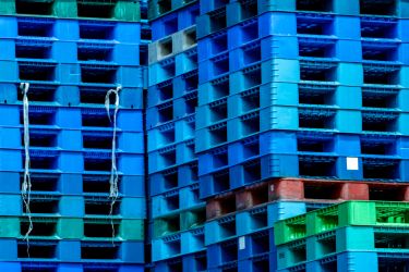 Stacks of plastic pallets