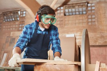 Man learning woodwork skills