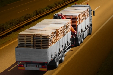 Truck transporting wood pallets