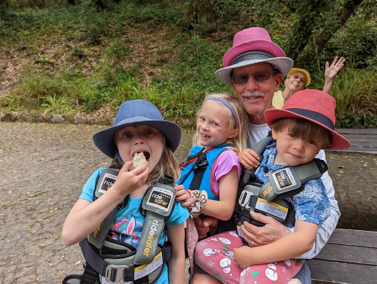 A big travel family buckle up in their ride safer car seats