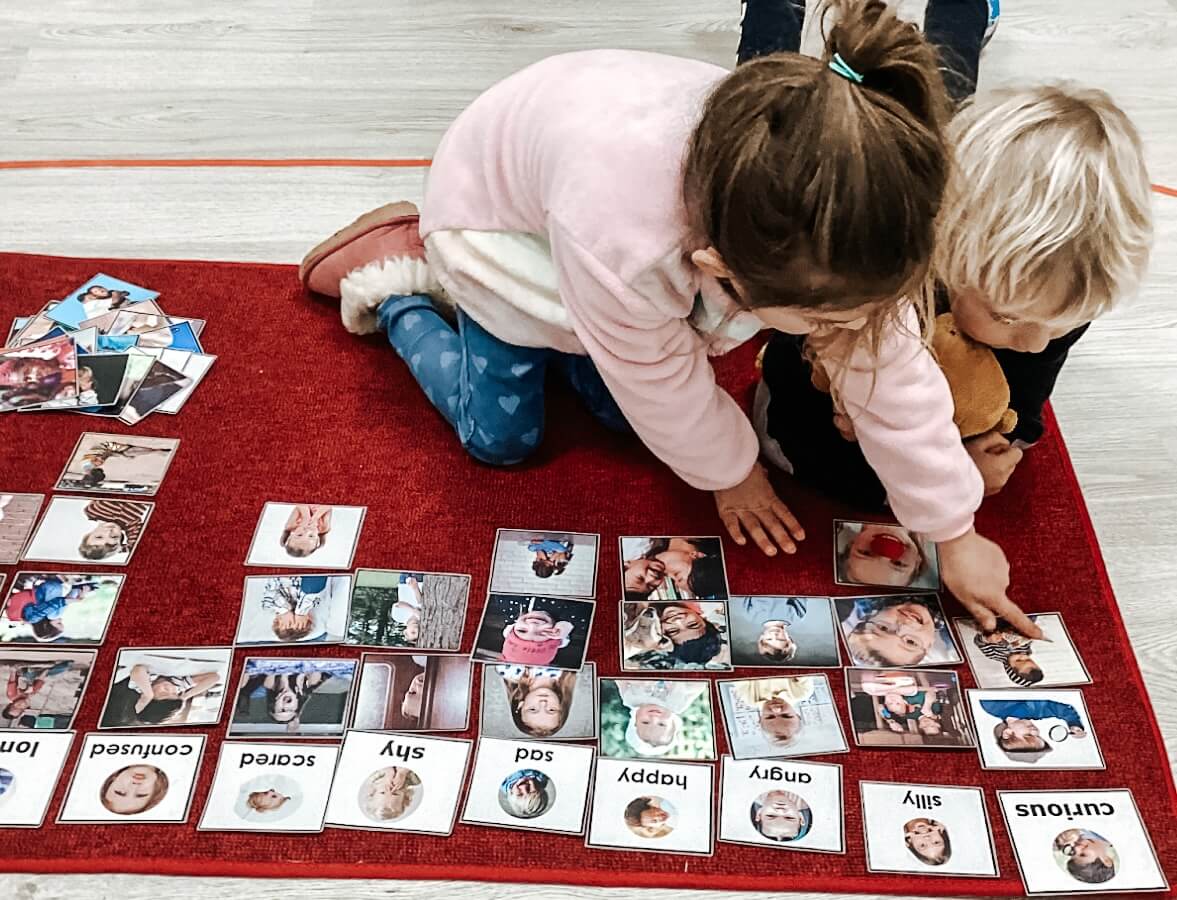 Two young children explore an activity, related to social emotional development and learning at Boundless Education Center