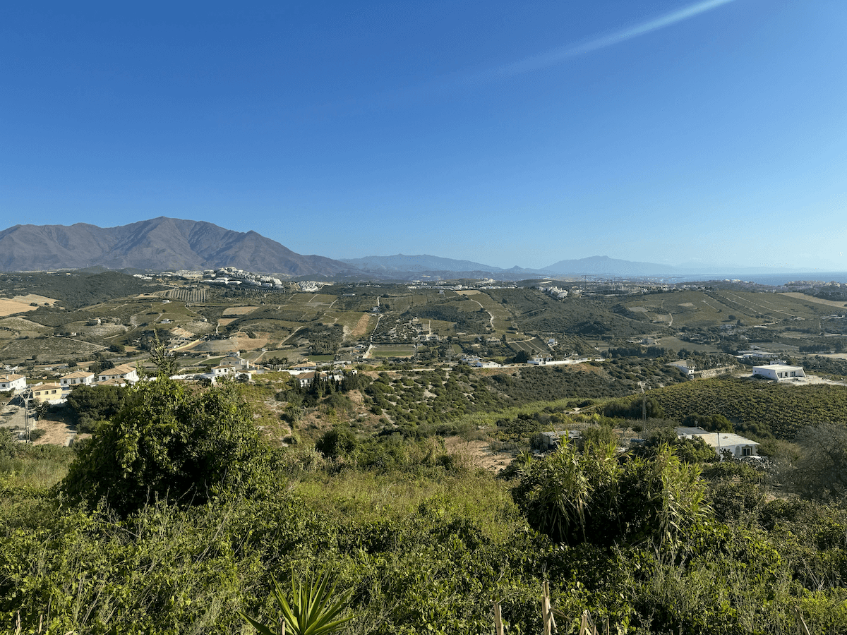 A beautiful Andalusian mirador over green land and mountains - Estepona, Spain: A Family Travel Guide to Andalusia