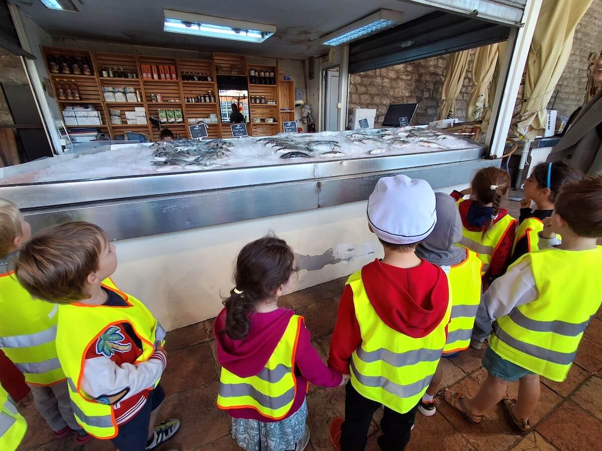 A group of Boundless Life children on a field trip to the market - building a new global generation