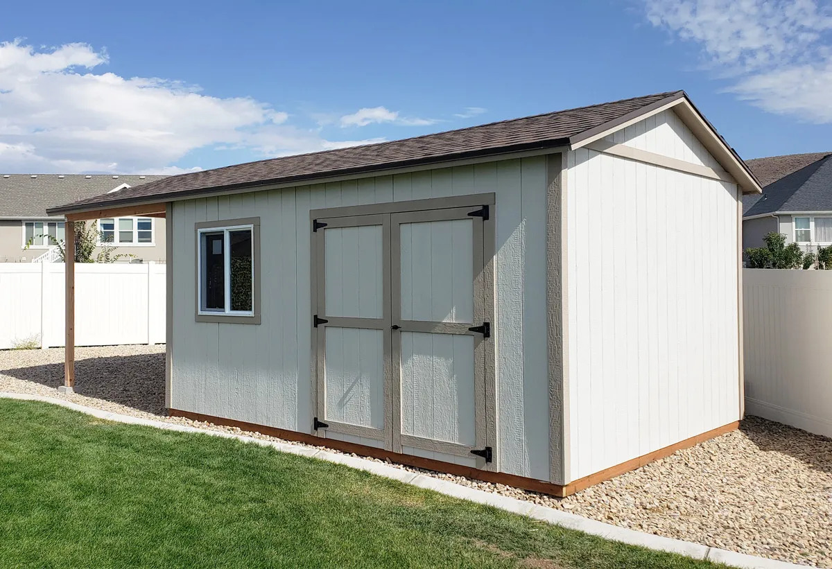 Tall A-frame storage building with an extended roof and double doors