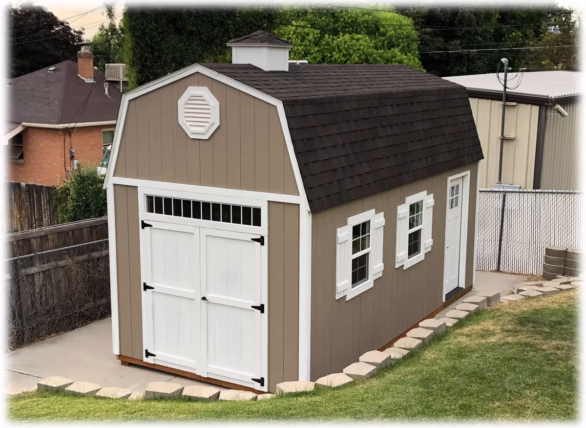 Tall barn-style building with a gambrel roof and double doors