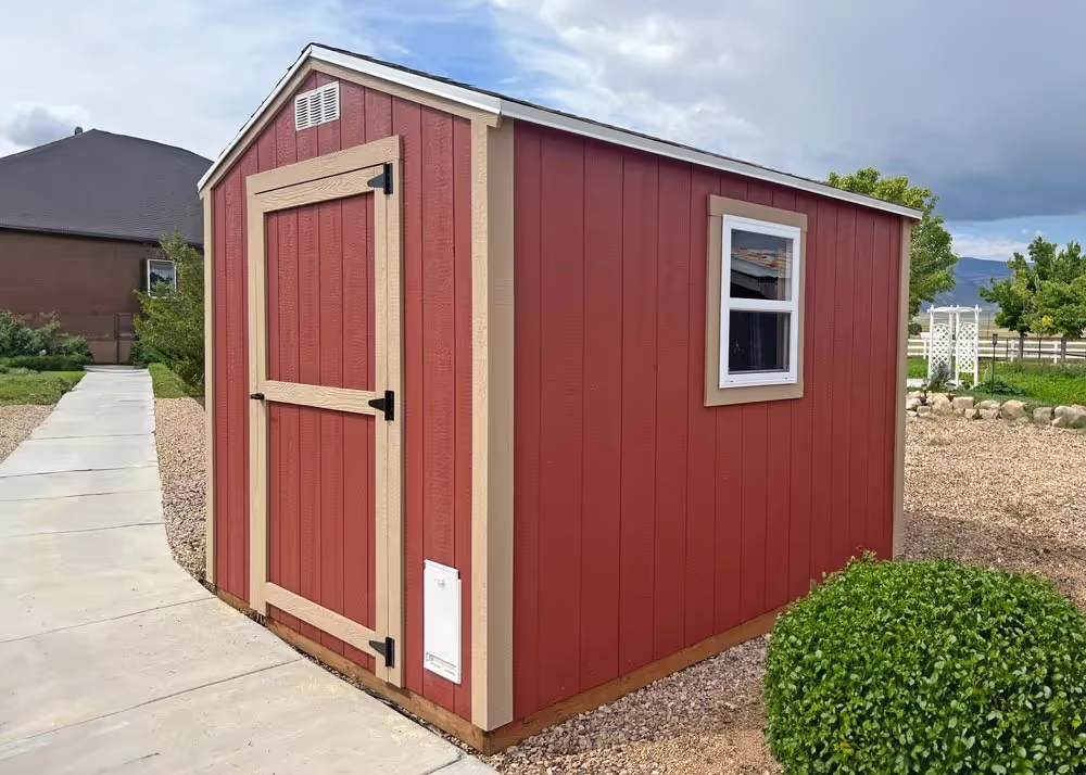 An 8 foot by 10 foot standard apex storage shed with a dog door