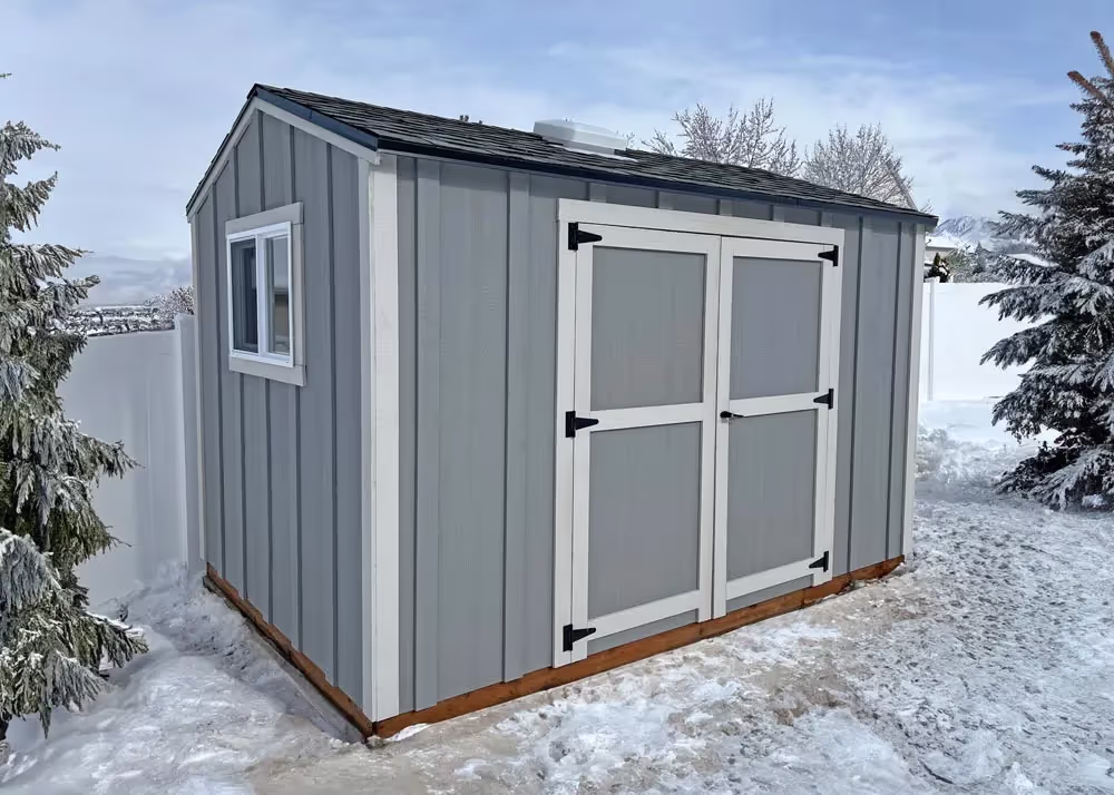 An 8 foot by 12 foot standard apex shed with board and batten siding