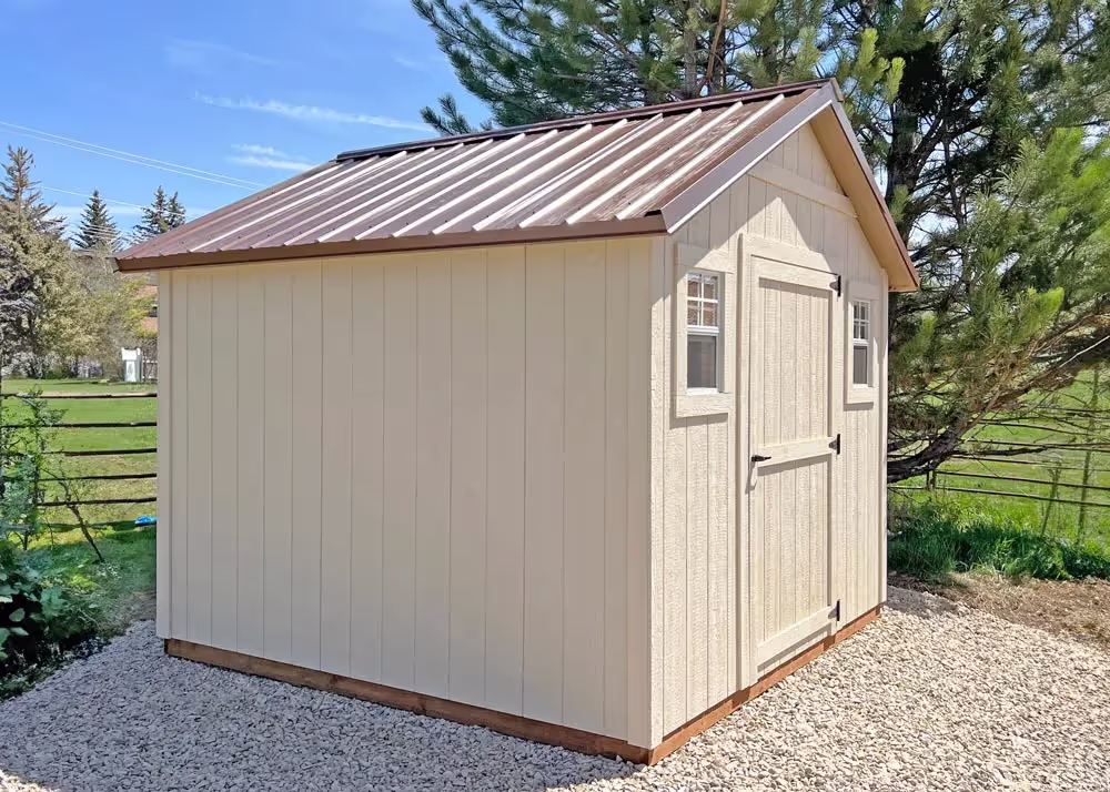 A 10 by 10 standard apex storage shed with a copper metal roof