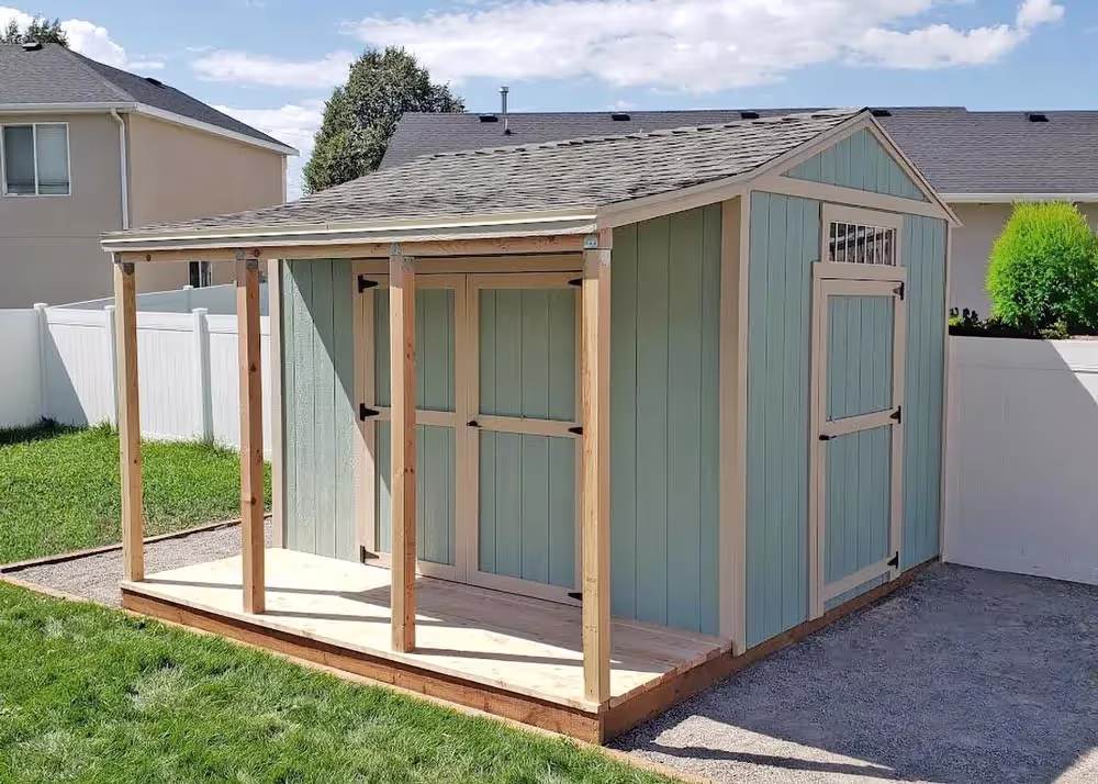 A 10 foot by 12 foot Tall Apex storage shed with a porch on the side wall