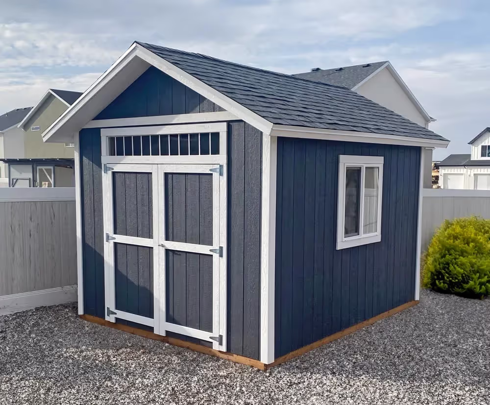 A 12' by 12' Tall apex with a custom roof pitch, 12" overhang and a transom window over the door