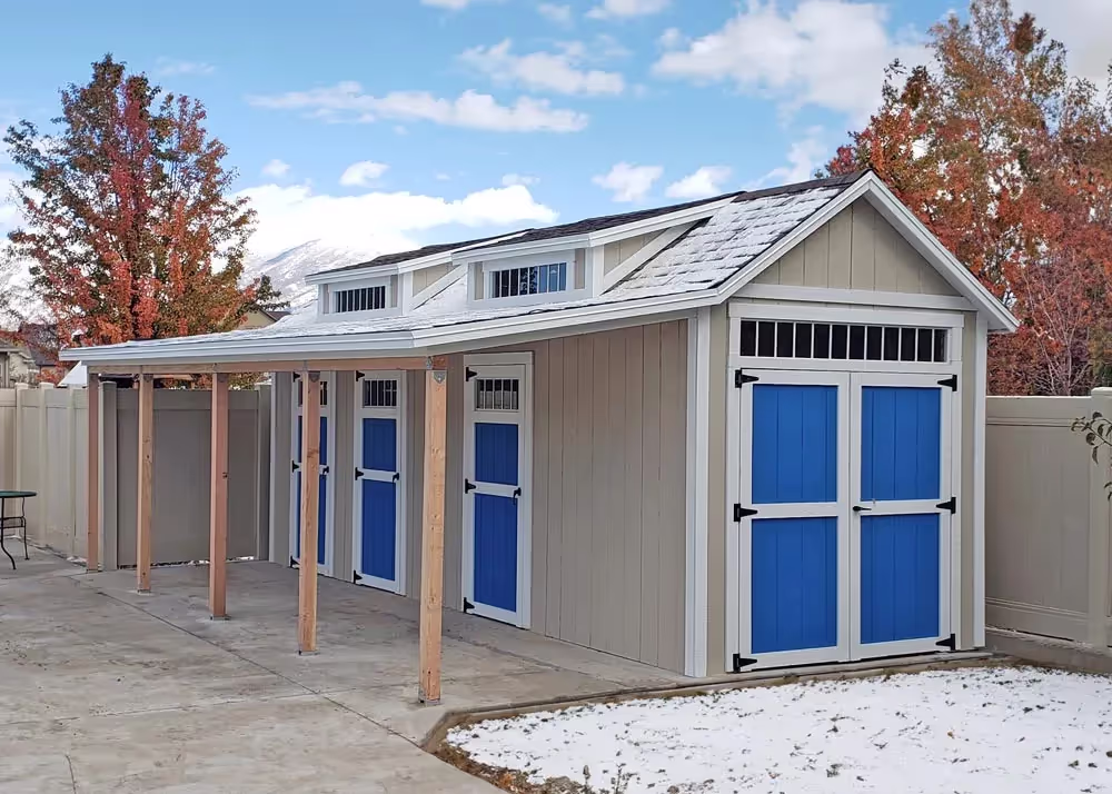 An 8' by 24' Tall Apex pool house shed with 3 doors, two dormers and a porch overhang