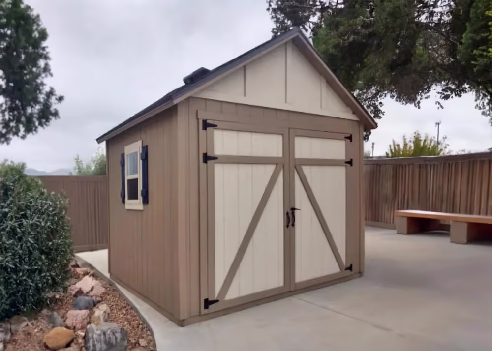 A custom 10' x 14' Tall Apex with custom door trim and a custom roof pitch
