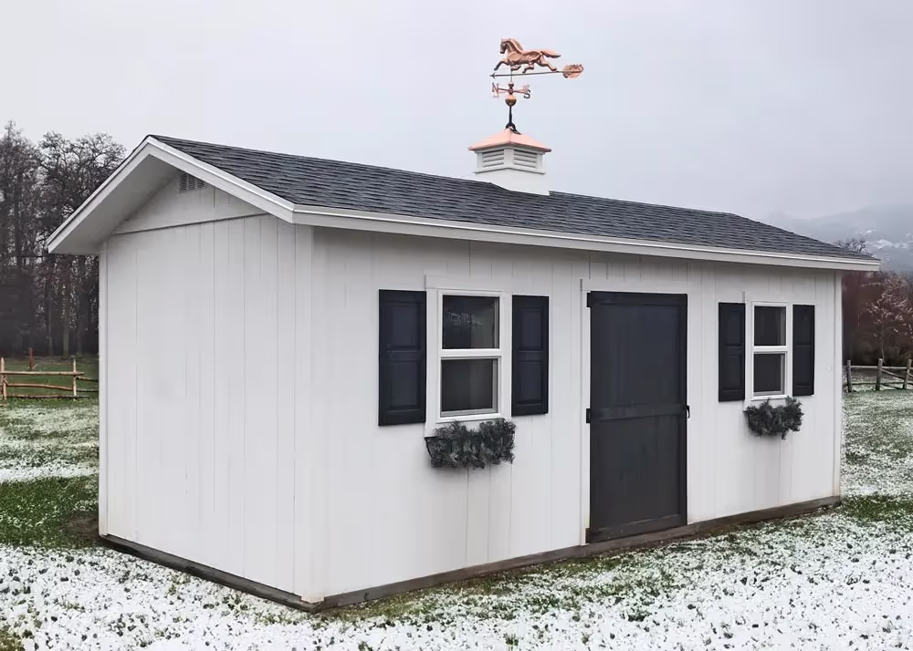 A 10' x 20' Tall Apex with a vinyl cupola and window shutters