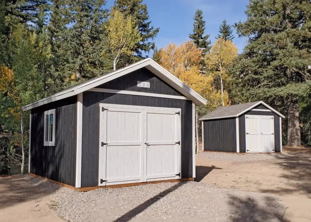 Two Sheds next to each other.  One 12x16 Tall Apex and One 10x12 Standards Apex\