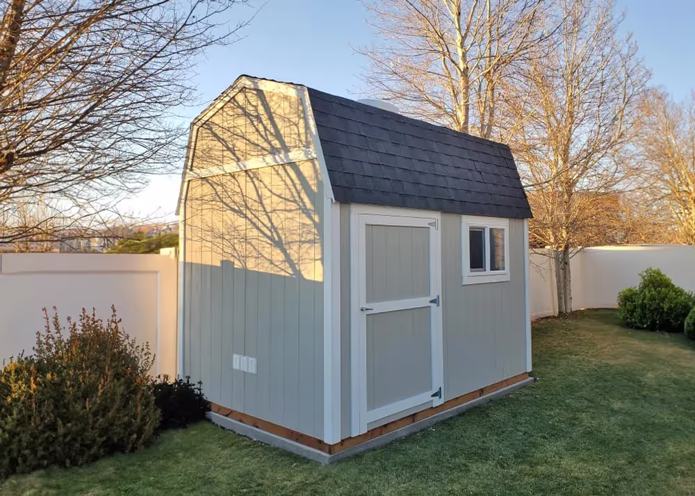 an 8 foot by 12 foot tall barn with the door and a window on the side wall