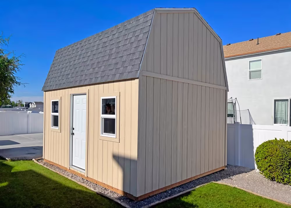A 12 foot by 16 foot Tall barn shed with a steel entry door on the side wall