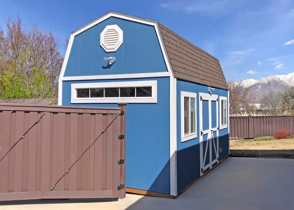 A 10 foot by 20 foot tall barn storage shed and workshop with a transom window on the end.