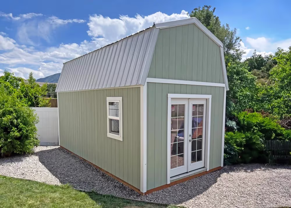 A 10 foot by 20 foot Tall Barn storage shed with a french door