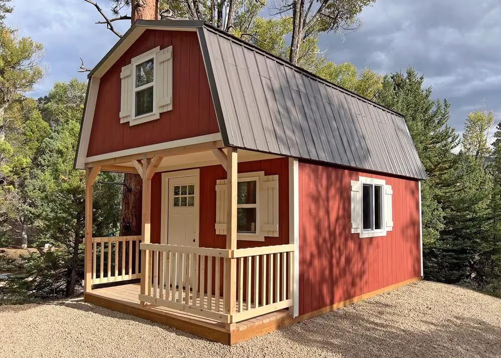 A 12 foot by 20 foot Custom Tall Barn shed with a loft over the porch, porch railing and a lot more...