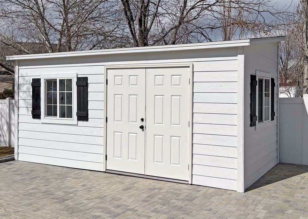 An 8 foot by 18 foot Tall Lean-To shed with custom lap siding