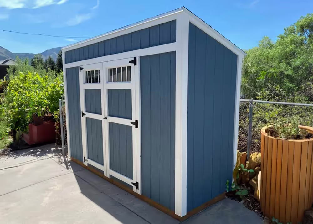 A 4 foot by 12 foot lean-to shed with a 6 foot wide double door with transom windows
