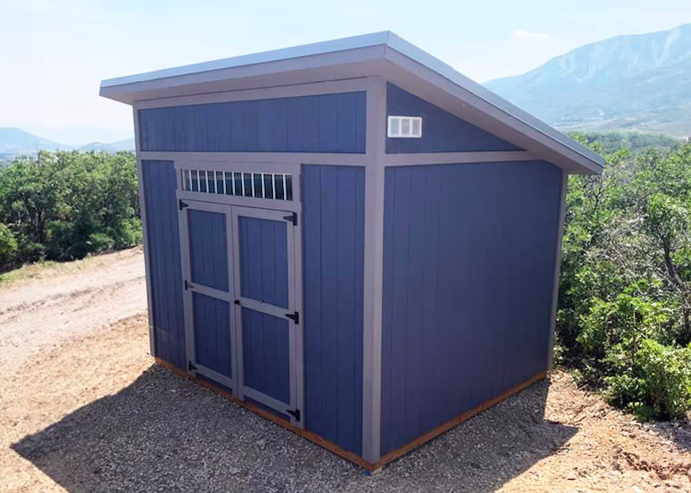 A 10 foot by 12 foot Tall Lean-To shed with a 6 foot wide double door and and a transom window over the door