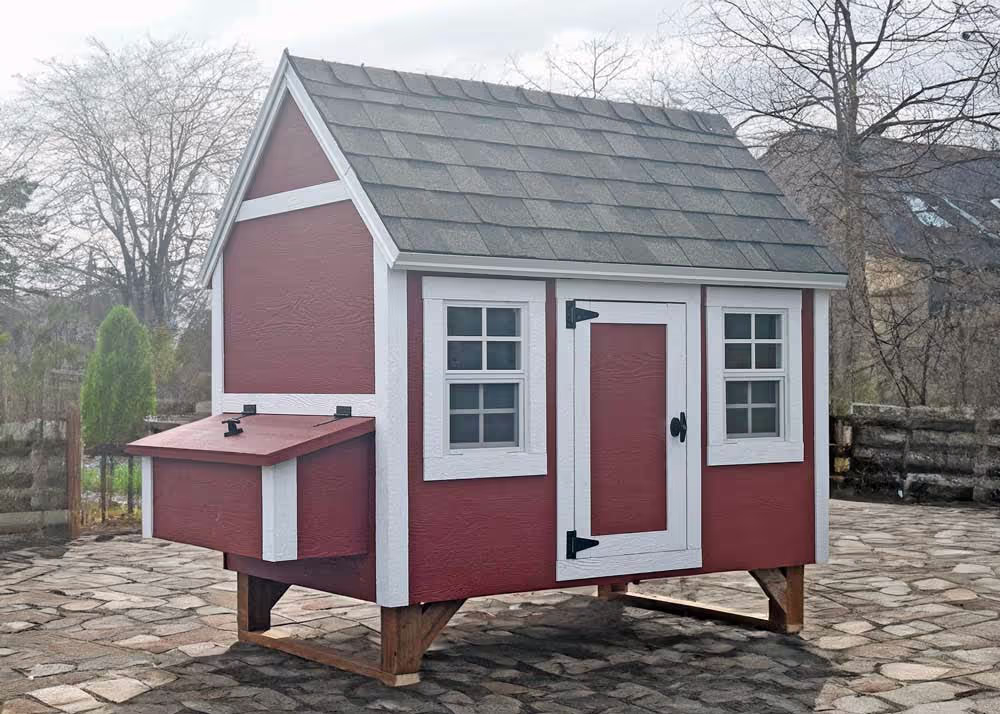 A large hen hut chicken coop in a back yard