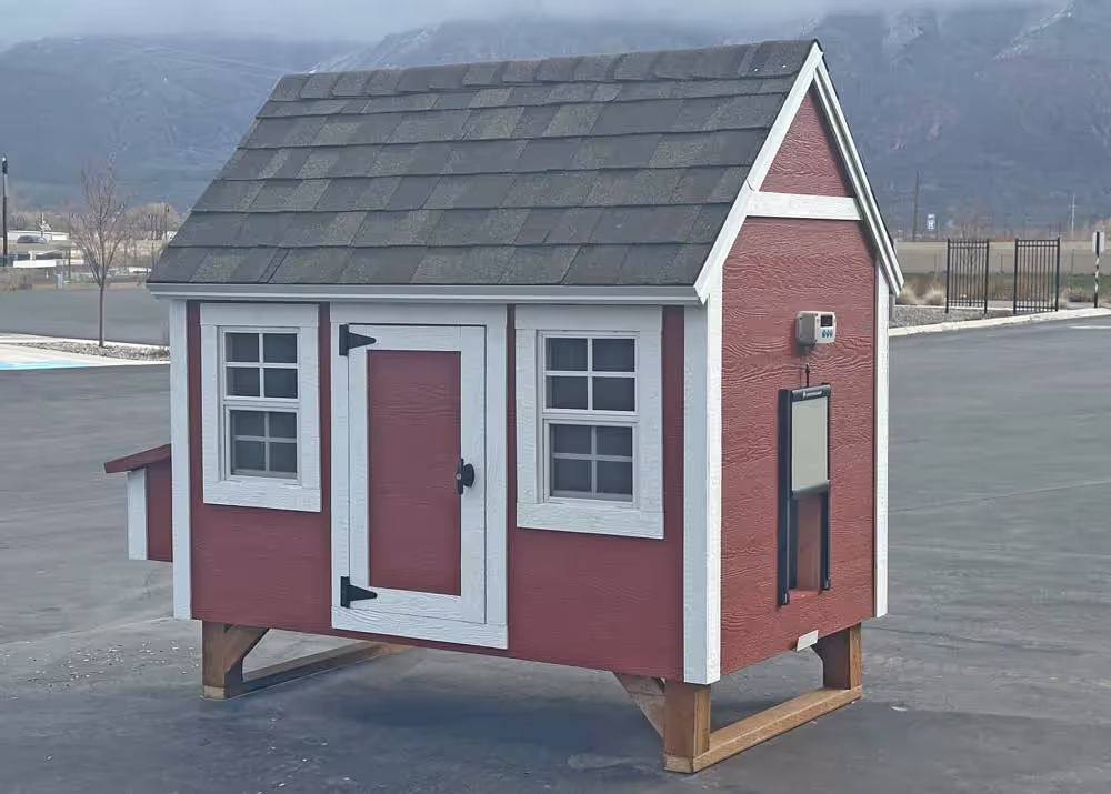 A Large Hen Hut Chicken Coop in Red and White