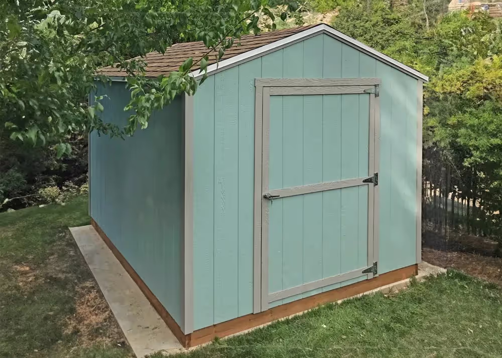 An 8 foot by 10 foot Value Apex storage shed in green and gray