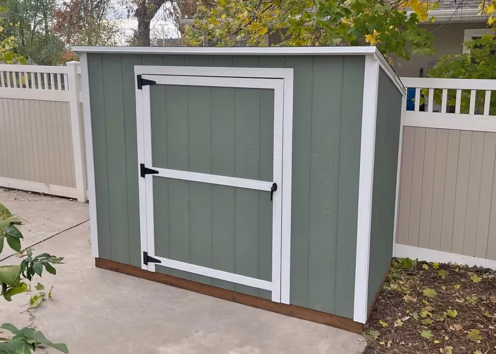 A 4 foot by 8 foot Yard Hutch mini lean-to storage shed