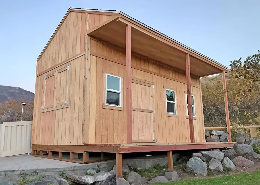 A custom 14 foot by 20 Foot Tall Tack shed with 10 foot walls and T-111 Siding