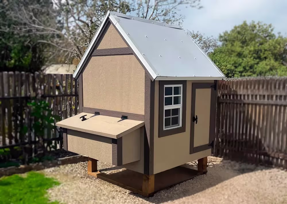 A Brown and Tan Medium Hen Hut with white metal roof