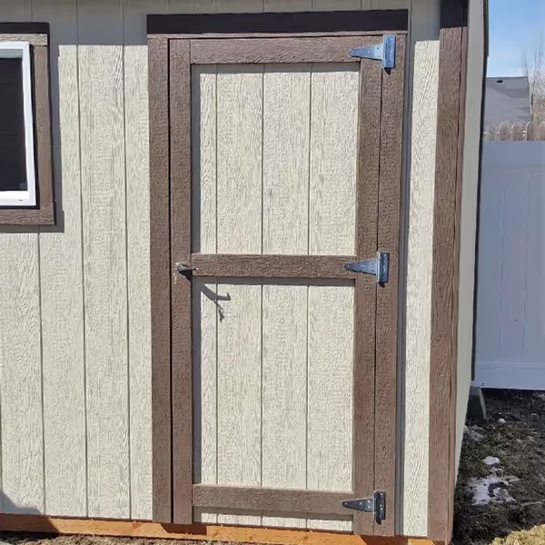 Durable 3' wide shed door with a sturdy frame and secure hardware, designed for easy access and a classic look