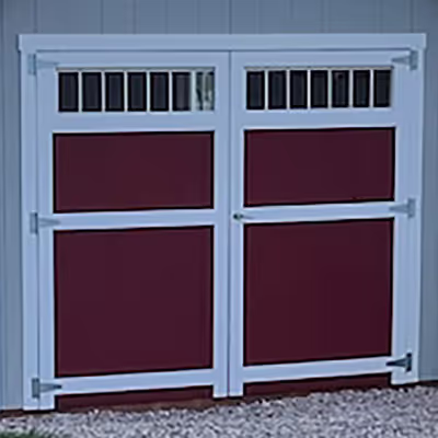An 8' wide double shed door with transom windows in the door.