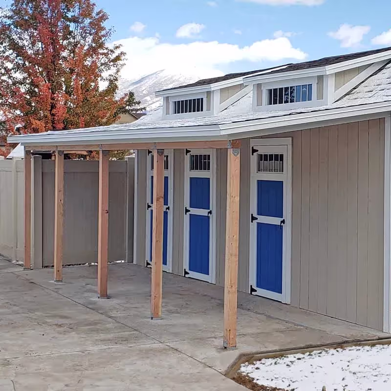 A porch overhand added to a custom shed used as a pool house