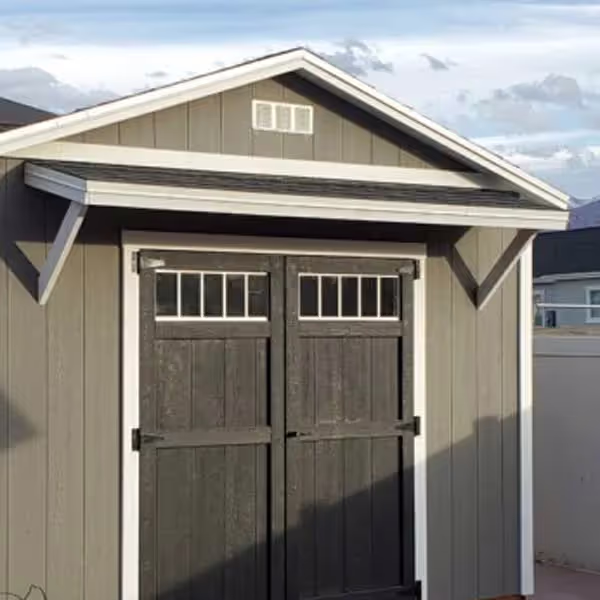 A Tall Apex shed with a porch awning over the doors