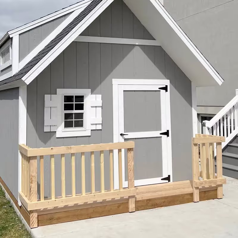 A porch railing on a custom clubhouse playhouse shed