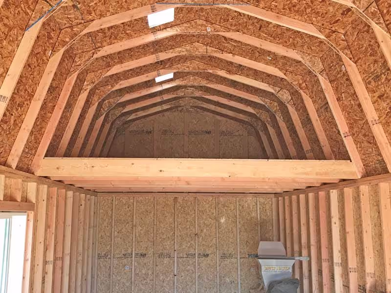 Barn shed interior with a 4' deep loft for added overhead storage, maximizing space with a sturdy design.