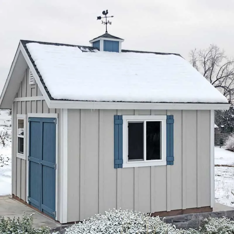A custom shed with our board and batten siding in the winter.