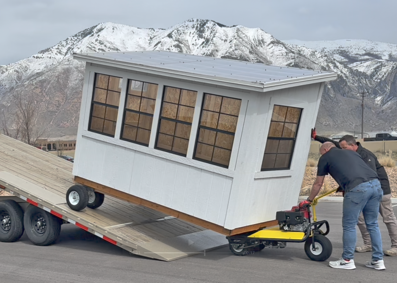 Loading a Greenhouse Shed on our shed moving trailer