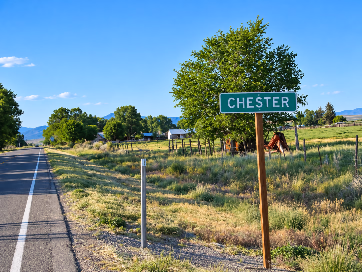 Chester, Utah roadside sign with the surrounding countryside