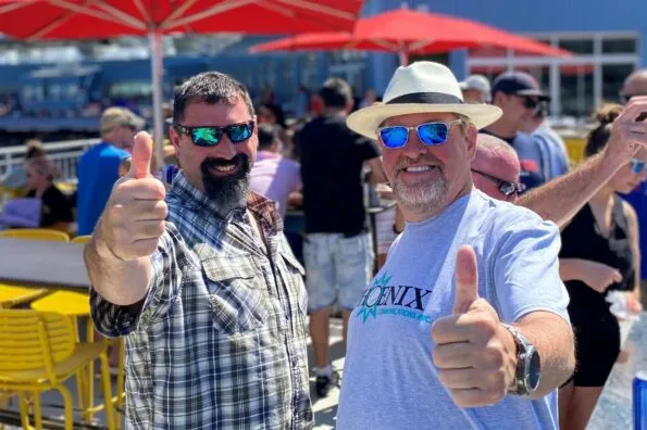 Two Phoenix Employees Giving Thumbs Up