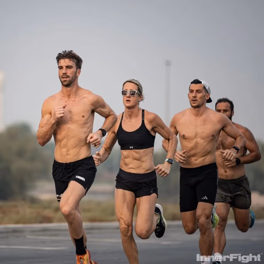Male and female CrossFit athletes running outdoors