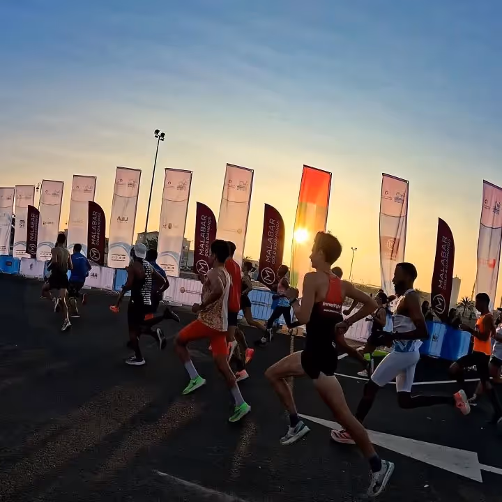 Endurance athletes running at sunset Dubai