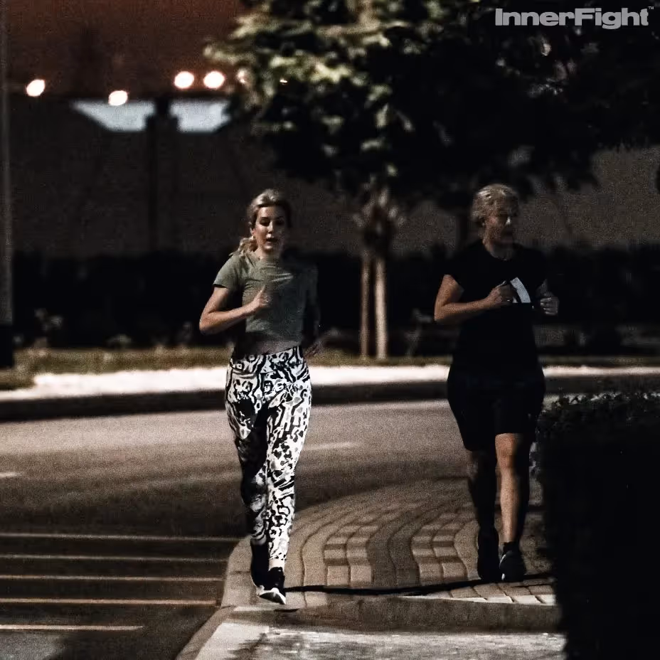 Two female runners at night in Dubai