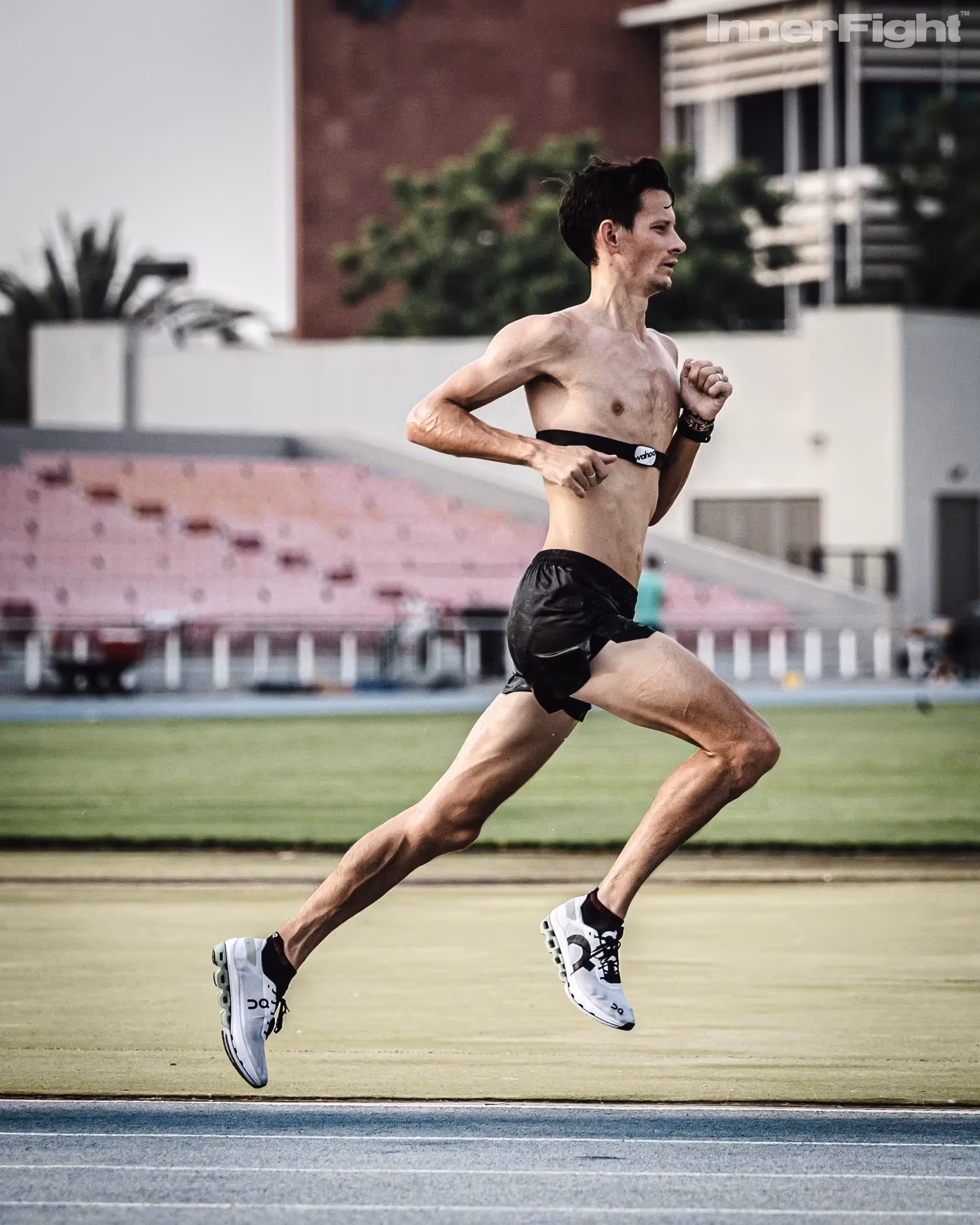 Male athlete running on a track in Dubai