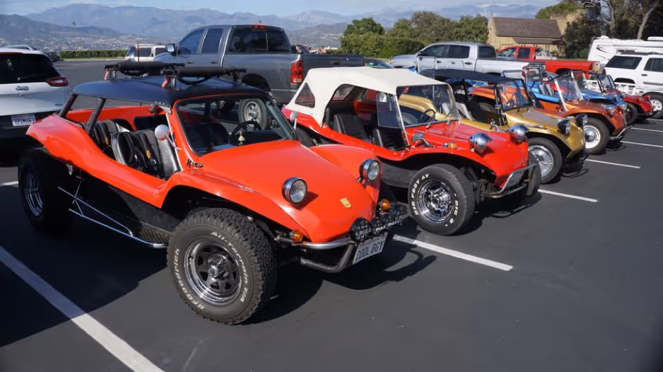 Meyers Manx vehicles lined up in a parking lot