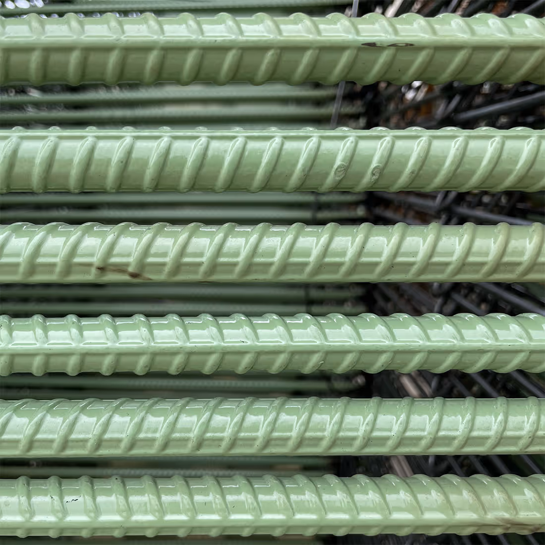 American Highway’s deformed steel tie bars installed in highway concrete pavement, ensuring stable longitudinal joints for high-traffic durability. Close-up of American Highway’s tie bars in airport runway concrete, preventing slab separation for long-lasting, high-traffic performance.
