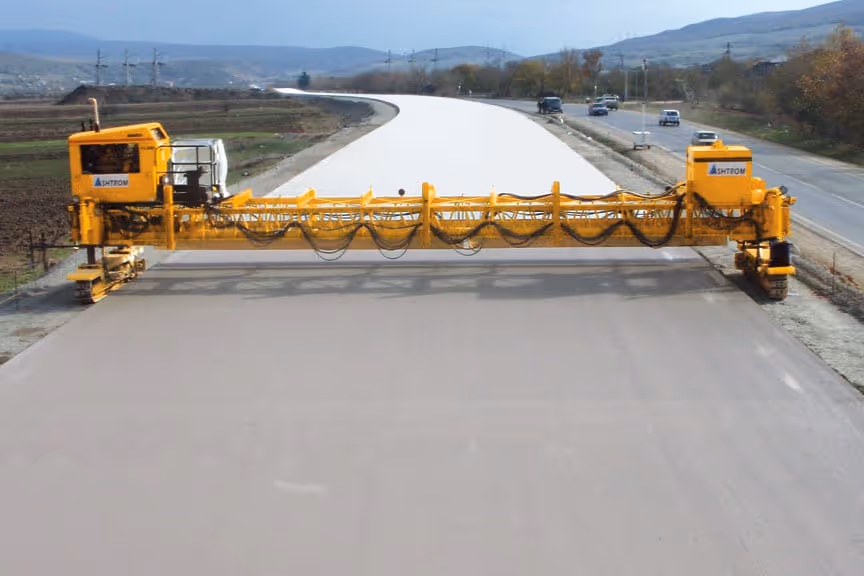 American Highway’s curing agents applied to warehouse concrete flatwork, enhancing strength and preventing cracking in high-traffic environments. Close-up of American Highway’s curing compound on industrial flatwork, ensuring moisture retention for durable concrete surfaces.
